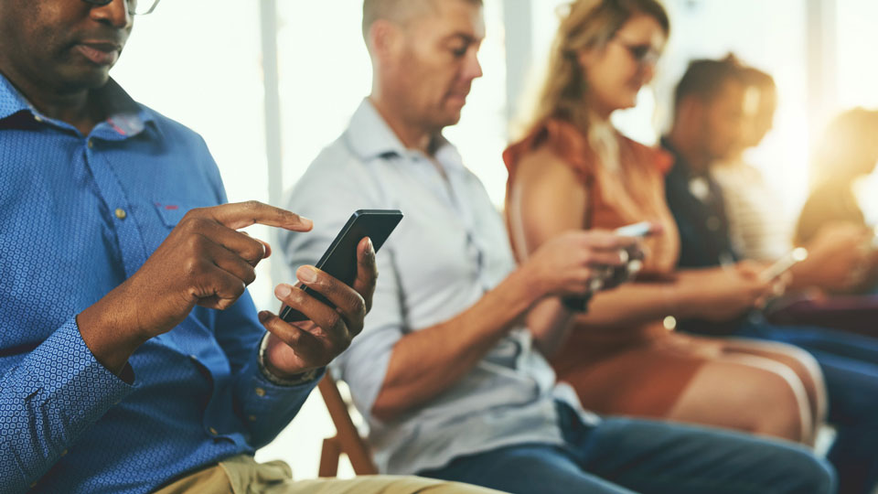 people on their smartphones